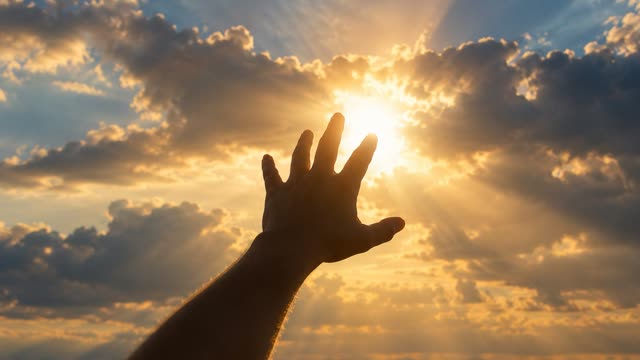 Hand reaching sky